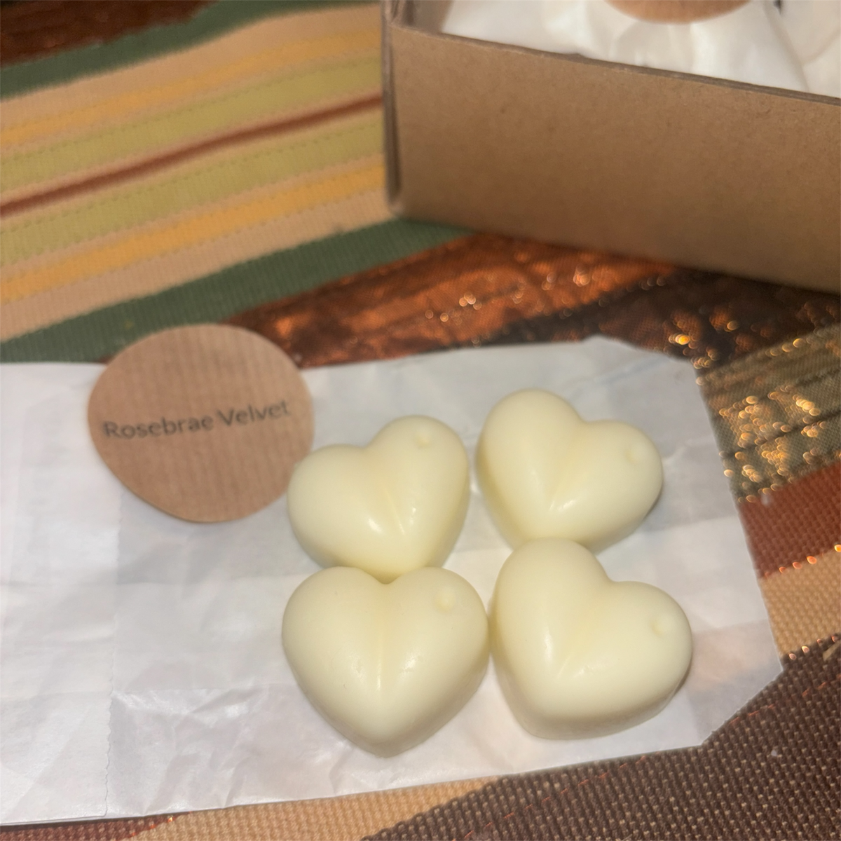 Four heart-shaped cream wax melts from the scent discovery box by Wilderness Brae Home Fragrance