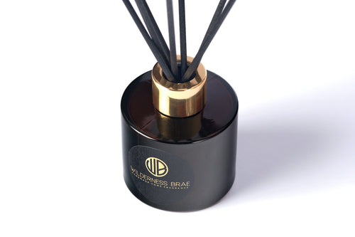 Caledonian Yule diffuser bottle close up with black and gold Wilderness Brae, Handcrafted in Scotland label