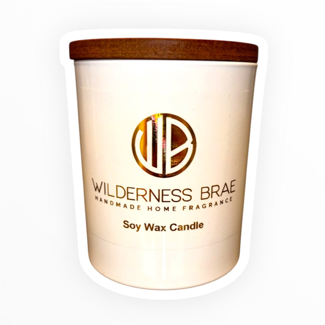 Soy wax candle with a wooden lid on a white background, branded 'Wilderness Brae'.