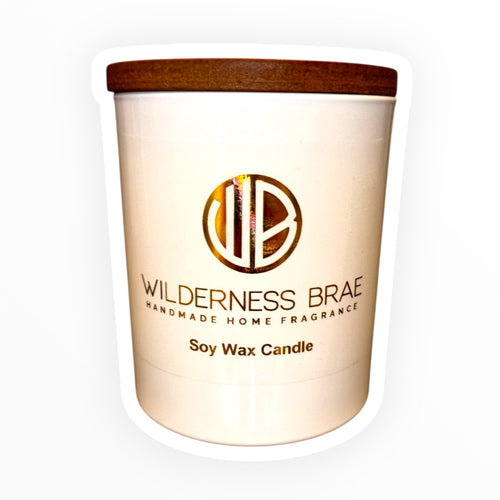 Soy wax candle with a wooden lid on a white background, branded 'Wilderness Brae'.