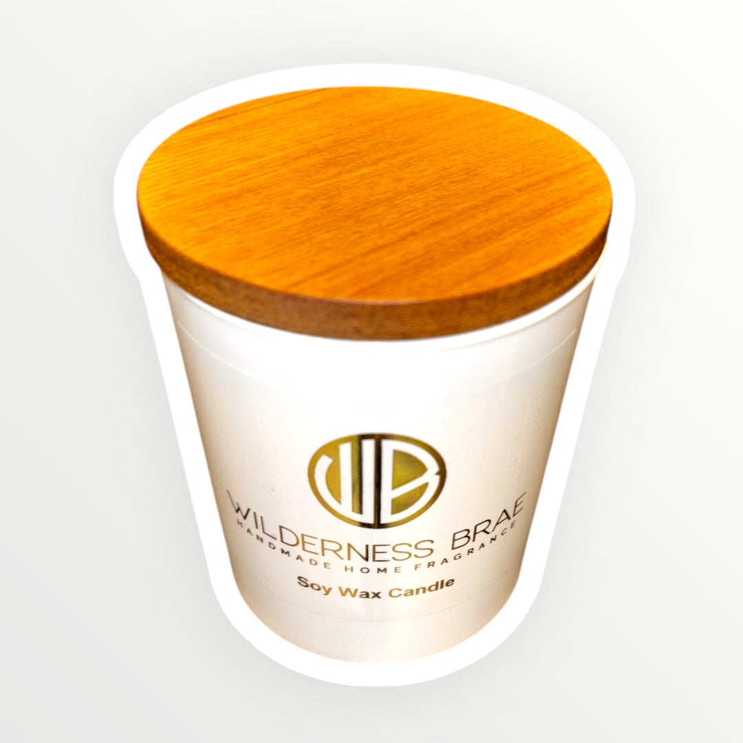 Soy wax candle with wooden lid on a white background