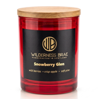 Snowberry Glen soy candle handcrafted in Scotland by Wilderness Brae. Red candle with Lid on, close up shot.