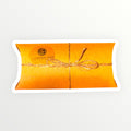 Krafe pillow-shaped box with string bow on a white background