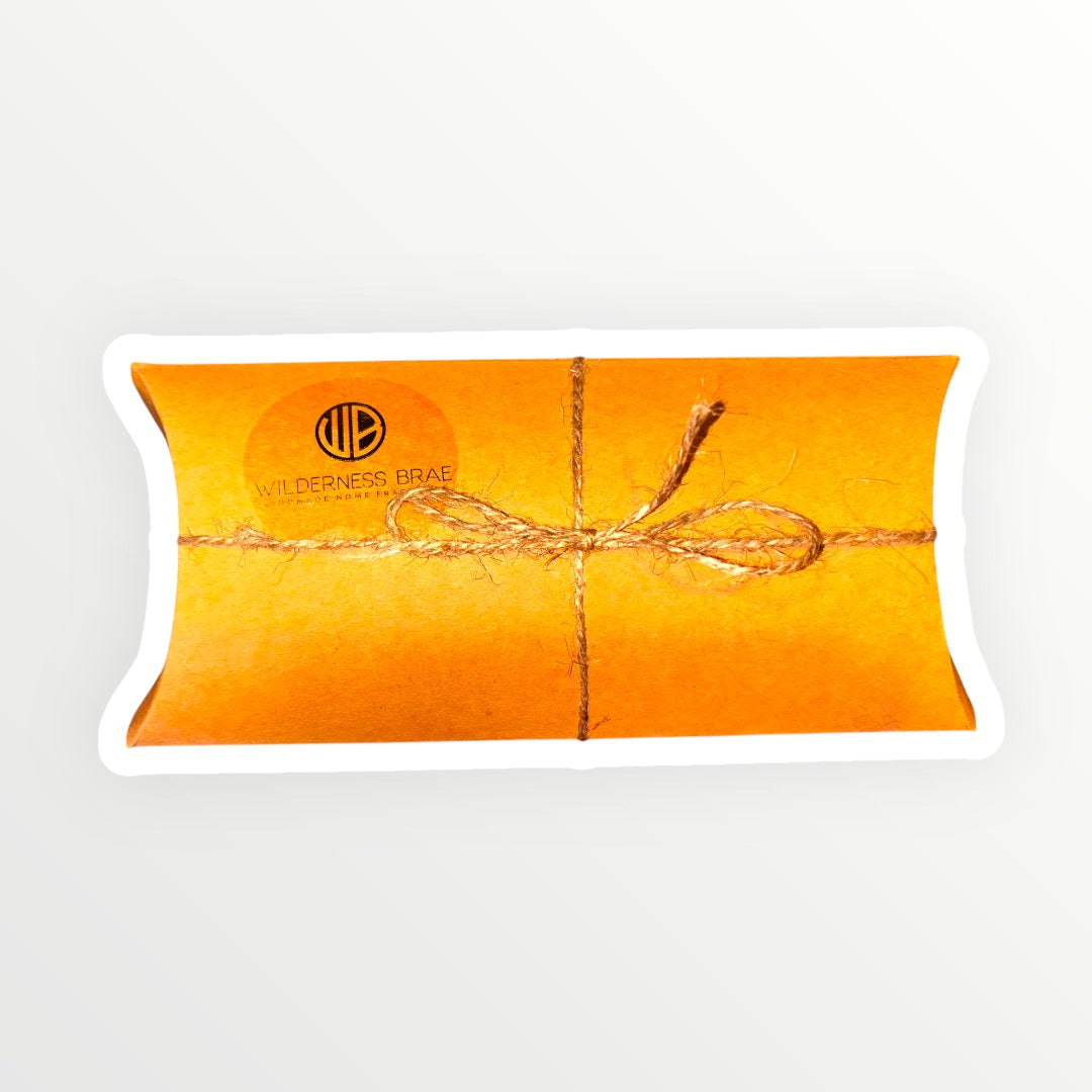 Krafe pillow-shaped box with string bow on a white background