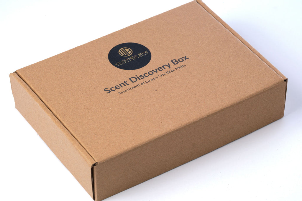 kraft box with black and gold round label